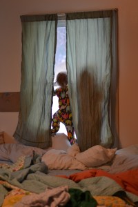 The girls love to climb up on the window sill and hide behind the curtain panels. Then they let go with their hands and fall back, landing on the cushion of the bed. It takes a lot of self-control for me to not freak out about this for fear of injury, especially after Nora just got four stitches on her forehead after running and tripping into the dining room table,