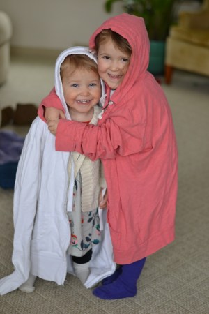 Trying on mommy's sweatshirts for fun.