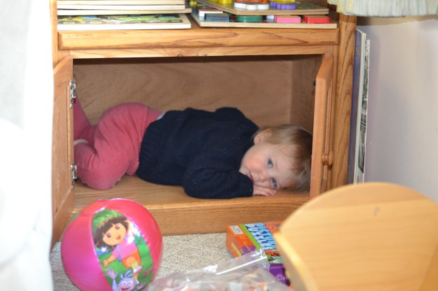 Favorite new hiding place: the puzzle shelf.